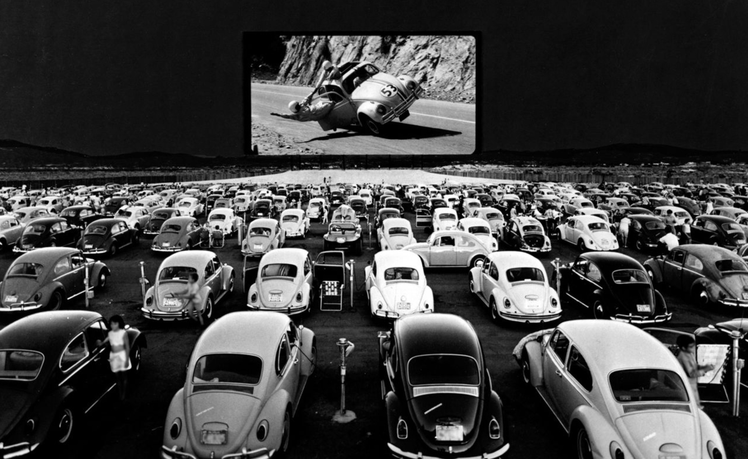 Volkswagen Beetles watching Herbie - The Love Bug at a drive-in theatre. San Fernando Valley, California. ca. 1960s 